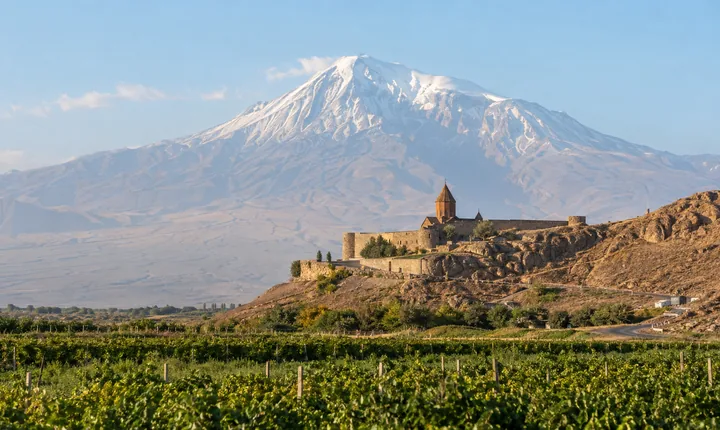 Khor Virap monastery and its approach road beneath snow-capped Mount Ararat