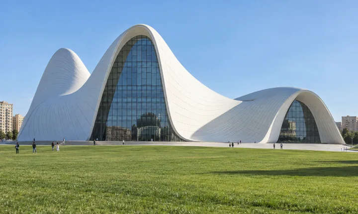 The white curved Heydar Aliyev Center above a green lawn in Baku