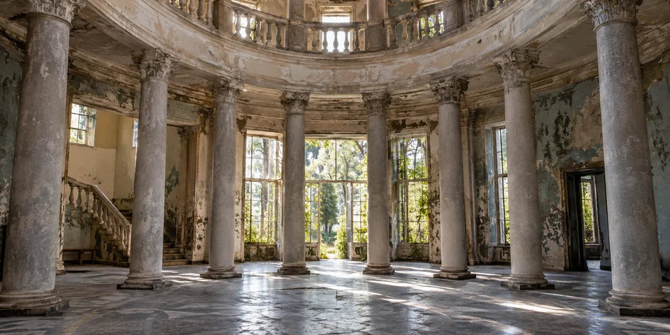 Sunlight falls across weathered columns and tiled floors in a Tskaltubo sanatorium hall
