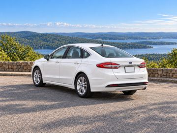 AI-generated illustrative Ford Fusion 2018, rear three-quarter in a dry paved scenic setting. Actual vehicle colour and equipment may vary.