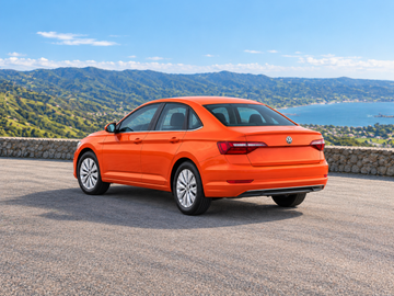 صورة توضيحية مولدة بالذكاء الاصطناعي لطراز Volkswagen Jetta 2019, منظر خلفي بزاوية ثلاثة أرباع في بيئة ذات مناظر طبيعية على سطح مرصوف جاف. قد يختلف لون السيارة الفعلية وتجهيزاتها.